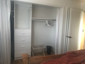Lots of storage space and organization in front bedroom closet.