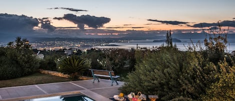 Villa Mariposa - Panoramic Cretan sea and Chania city view at colorful sunset.