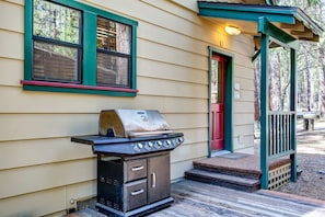 Gas BBQ and side door leading into kitchen area.
