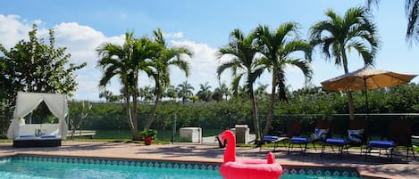 Lovely private heated pool area tucked away next to the Marina with palm trees.