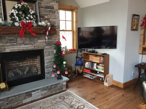 Pull out flat screen TV with Cable and Netflix in Living room.