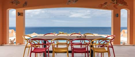 The large terrace with swimming pool and ocean view