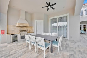 8 Person outdoor dining with Full Kitchen and Pool bathroom!
