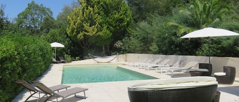 Upper garden and pool area. The pool has steps to enter and a pool alarm.