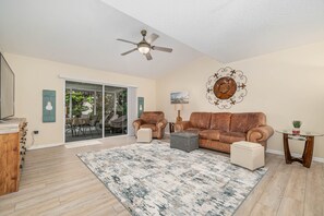 Plenty of space for all! Vaulted great room and sliding door access to lanai