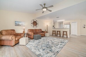 new vinyl plank flooring, comfortable furniture, games, books, and 55 inch TV