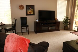 Large flat screen  smart TV with DVD player.