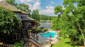 View of the Backyard - Bama Lakeside Retreat has a beautiful outdoor space including a heated pool.