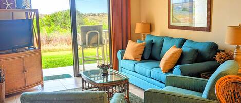 Bright & beautiful colors & view of common grassy area w/dunes beyond.