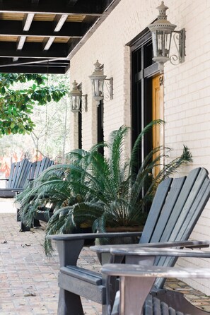 Watch the world go by on the front porch with seating for 6.
