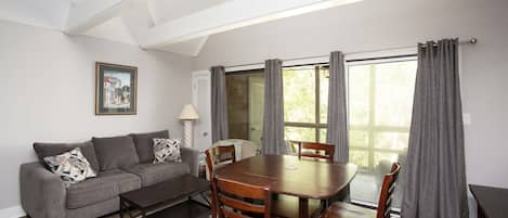 Beautiful cathedral ceiling makes this living space and kitchen airy and bright.