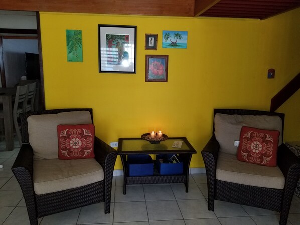 Lovely sitting room with double doors that open to the porch