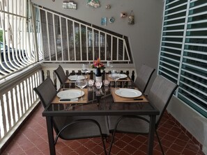 Dining for 4 on the porch; great for morning breakfast