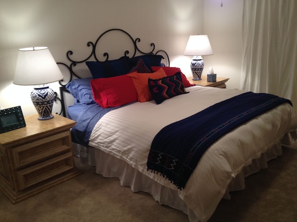 Master Bedroom with cozy down comforter, pillows and high thread count sheets