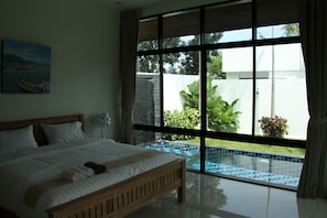 view of pool from master bedroom