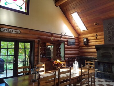 Log house lodge situated on a forested lot, peace, tranquility, country setting.