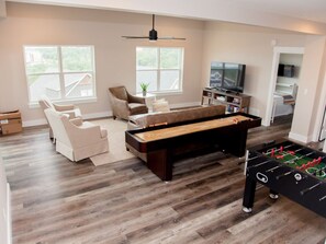 Downstairs living area includes entertainment!