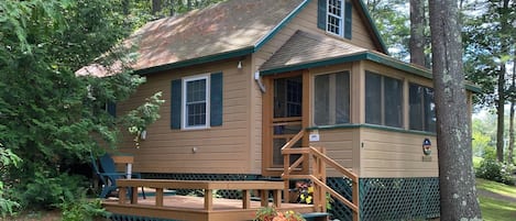 Front of cottage featuring the entrance to the screen porch via the deck.