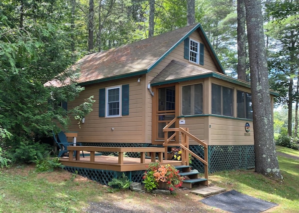 Front of cottage featuring the entrance to the screen porch via the deck.