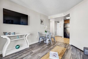 Immerse yourself in open-concept living, where the living area seamlessly transitions into the dining space, creating a spacious and welcoming environment for both relaxation and entertaining.