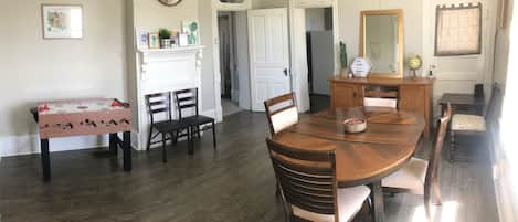 Dining room with high chair, lots of games, puzzles and a game table!