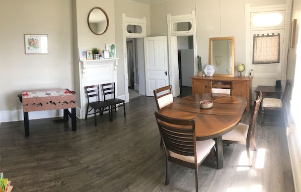 Dining room with high chair, lots of games, puzzles and a game table!