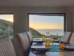Dining area with mountain  and ocean view