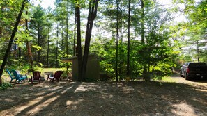 Your arrival view. Our parking, fire pit and play area.