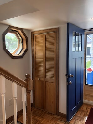 Entry with closet and stairway to 2nd floor 