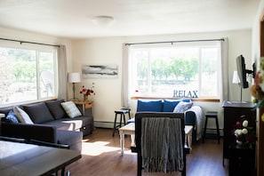 Living room with views of the Grand Mesa and the Fruit Basket orchard next door.