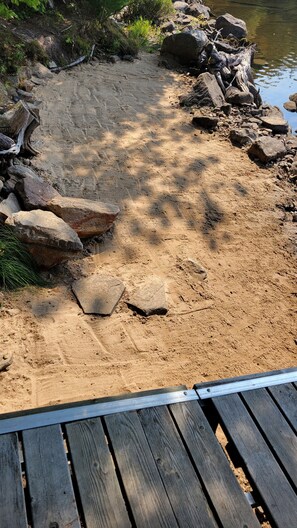 Sandy beachfront front floating dock. Beach toys and kayas, standup paddleboard