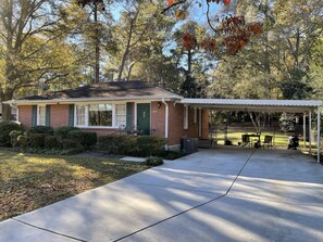 private home, carport with small table and chairs,  big fenced back yard   