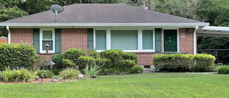 private home, carport with small table and chairs,  big fenced back yard   