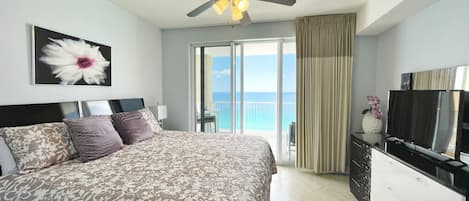 Master bedroom with ocean view and  king size bed .