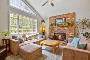 Living Room with cozy fireplace and comfortable couches!