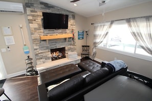 Big screen TV (cable), hand hewn mantle and gas fireplace!