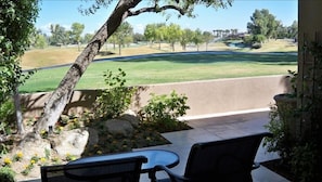 Majestic view of the clubhouse with the waterfall cascading into the lake.