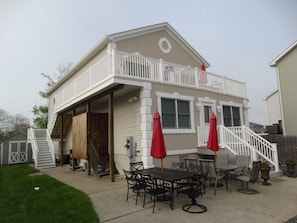 Side house view, Shows shared outside shower.