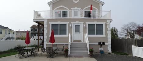 Front of house 1st Floor Unit with Patio Furniture