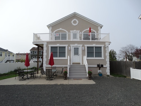 Front of house 1st Floor Unit with Patio Furniture