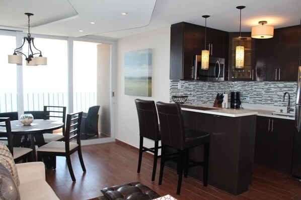 Open layout - kitchen, bar and dining area.