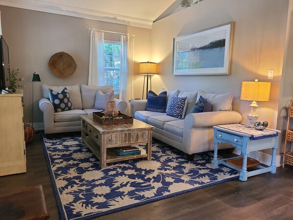 Open concept living room with vaulted ceiling