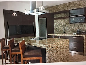 spacious kitchen with range and microwave