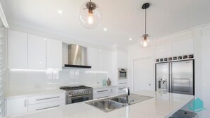 Kitchen with stainless steel appliance