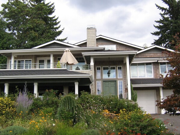 Front of house, the apartment is lower level on the left