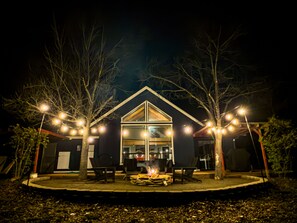 Firepit and string lights under starry skies!