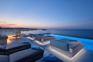 evening / sunset with citylights of Hersonissos town and panoramic seaview