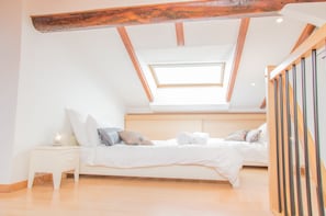 Second bedroom upstairs in a loft style. Featuring a set of twin beds (90cm each