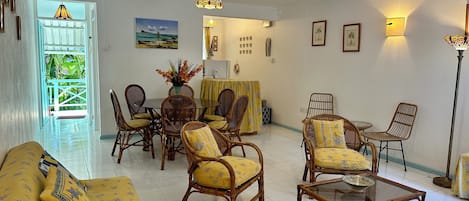 Air-conditioned living/dining room showing entrance to the apartment 