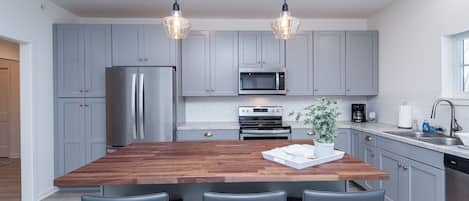 Brand new appliances include; refrigerator, stove, microwave and dishwasher.